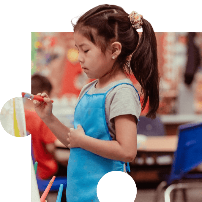 Child painting at El Rio Daycare in Tucson